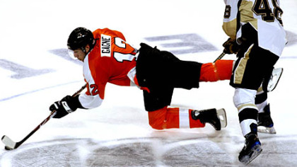 Tyler Kennedy collides with Philadelphia Flyers' Simon Gagne as they go for the puck in the third period last night in Philadelphia.