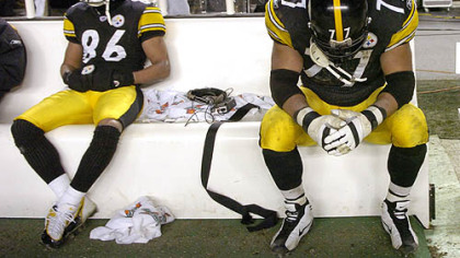 Pittsburgh Steelers Hines Ward,left, and Marvel Smith sit on the bench after the team 41-27 loss to the New England Patriots in the AFC Championship Game at Heinz Field on Sunday, January, 23, 2005.