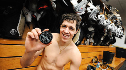 Evgeni Malkin celebrates in March after scoring his 100th point.