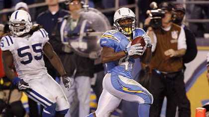 San Diego Chargers running back Darren Sproles, right, scores the winning touch down past Indianapolis Colts linebacker Clint Session in overtime during an NFL AFC wild-card playoff game last Saturday in San Diego.
