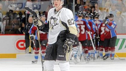 Sidney Crosby skates off as Colorado celebrates its 5-3 victory yesterday in Denver.