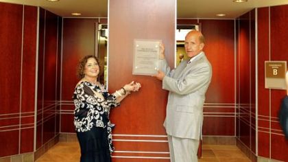 Anna and Edward Dunlap hold the plaque that will be placed outside of the Dunlap Conference Center off the lobby at St. Clair Hospital.  The hospital held a dedication ceremony for the renovations.