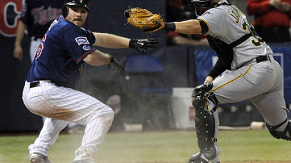 Minnesota Twins Jason Kubel, left, looks for the call after he was tagged out by Pirates catcher Jason Jaramillo after Kubel tried to score from first on a double by Michael Cuddyer in the second inning of last night's game.