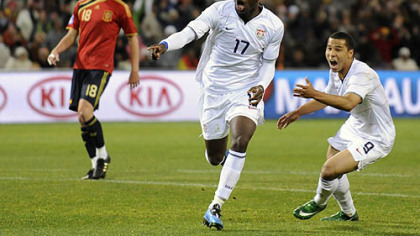 United States' Jozy Altidore, center, reacts after scoring a goal, with teammate Charlie Davies, right, as Spain's Albert Riera, looks on, during their Confederations Cup semifinal match at Free State Stadium in Bloemfontein, South Africa, yesterday. The Unite States won, 2-0.
