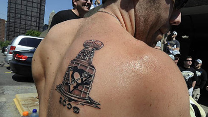 Pascal Dupuis shows off his new tattoo.