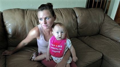 Marjorie Dillon, 26, with her 9-month-old daughter. Ms. Dillon is saddled with debt from her college education.