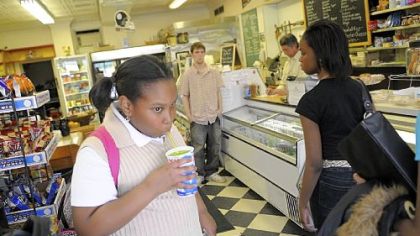 Tyler Randolph, 11, stops in at the Frick Park Market on the way home from school to drink a lemon-lime slushie.
