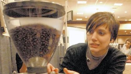 Dana Waelde prepares her coffee grinder yesterday at the start of the competition.