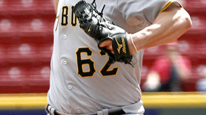 Pirates pitcher Daniel McCutchen throws against the Reds in the first inning of game one of a doubleheader yesterday in Cincinnati.