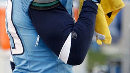 Titans defensive end Jevon Kearse pretends to blow his nose on a"Terrible Towel".