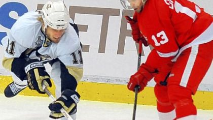 Detroit's Pavel Datsyuk scored two points in his return to the lineup last night. Here he battles the Penguins' Jordan Staal for the puck.