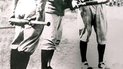 The Pirates' Honus Wagner and the Tigers' Ty Cobb, right, test a baseball bat during the 1909 World Series.