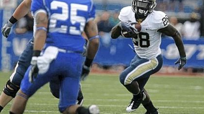 Pitt's Dion Lewis swings to the outside for some of his 190 yards yesterday at UB Stadium in Amherst, N.Y. Lewis' day included an 85-yard run for a touchdown to put the Panthers ahead, 47-27, late in the game.