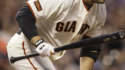 Giants first baseman Ryan Garko runs to first base after hitting a fly out during the fourth inning.