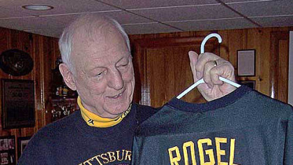 Bill Priatko, of North Huntingdon, holds a replica jersey of Fran Rogel, a fellow former Steeler, from North Braddock.