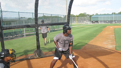 Pirates outfielder Lastings Milledge takes an at-bat against pitcher Phil Dumatrait during a simulated game at Pirate City in Bradenton, Fla. yesterday.