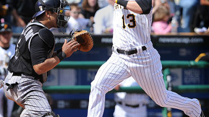 Nate McLouth crosses home after scoring the go-ahead run in the 7th inning against the Rockies yesterday.
