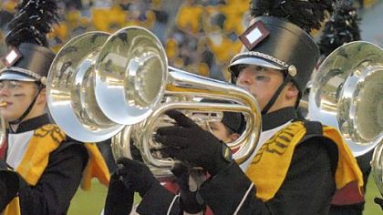 William Prince, a senior at Elizabeth Forward High School, wears a Terrible Towel on his uniform while performing with the marching band before the Steelers Jets playoff game in January 2005.