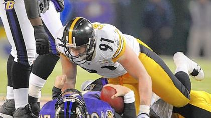 Defensive end Aaron Smith stands over top of Ravens quarterback Joe Flacco after a sack Dec. 14 at M&T Bank Stadium in Baltimore.