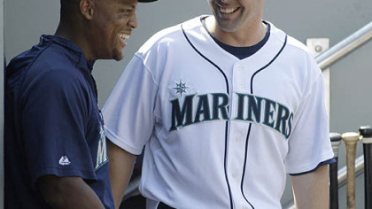 Mariners third baseman Adrian Beltre, left, visits with new Mariners shortstop Jack Wilson, right, after he arrived in the dugout during their game against the Toronto Blue Jays yesterday at Safeco Field in Seattle.