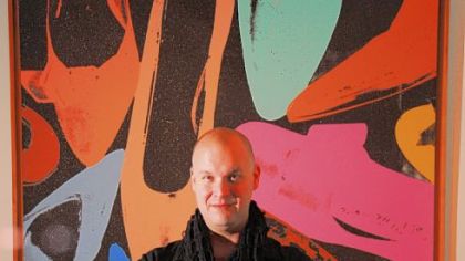 Newly appointed Warhol Museum curator Eric Shiner with Warhol's "Diamond Dust Shoes."