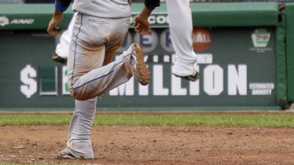Pirates pitcher Matt Capps leaps but can't get to a high relay throw as Mets first baseman Fernando Tatis scores from second on a 10th-inning single by Ryan Church yesterday. The Mets won, 9-8, in 10 innings.