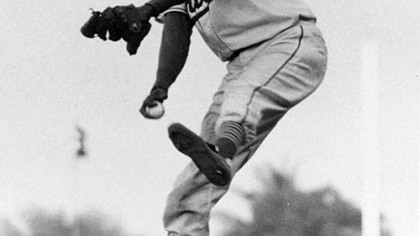Satchel Paige winds up for the pitch against the Montreal Royals in the second game of the doubleheader April 29, 1956 in Miami.