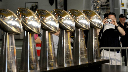 John McGee gets a photo of the six Super Bowl trophies during the Steelers 2009 Fan Blitz at Heinz Field.