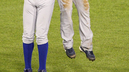 Cubs left fielder Alfonso Soriano, left, and teammate Ryan Freel celebrate after the final out of the Cubs' 3-1 win last night.