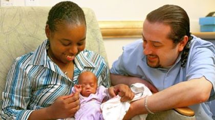 Brittany Rideout and Adam Bouchat hold their 2-pound, 14.5-ounce baby, Taylor Rideout, yesterday. Taylor was 12.5 ounces and 10 inches long when she was born March 12 at 26 weeks gestation.