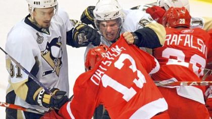 Down big midway through Game 5 last night at Joe Louis Arena, emotions boiled over. Sidney Crosby, center, tangles with Detroit's Pavel Datsyuk.