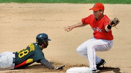 Craig Monroe beats the throw to second base as Boston Red Sox second baseman Ivan Ochoa is late with the tag in the fourth inning yesterday in Fort Myers, Fla.