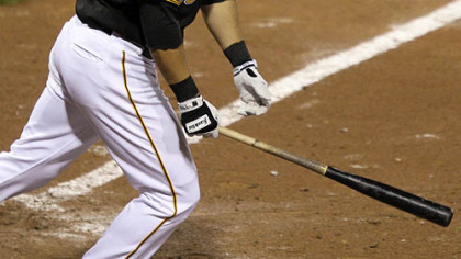 Pirates outfielder Garrett Jones follow through on a walk-off 14th-inning solo home run off Giants pitcher Bob Howry.