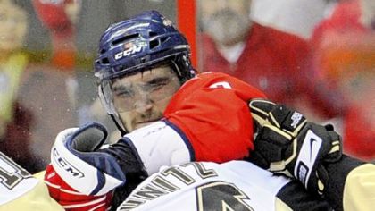 Washington Capitals left wing Alex Ovechkin, back,  mixes it up with left wing Chris Kunitz during the first period of Game 2 of an NHL hockey second round playoff series earlier this month.