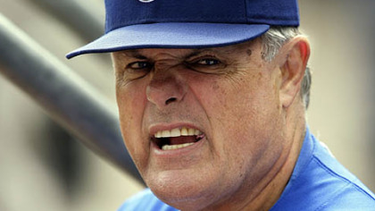 Cubs manager Lou Piniella grimaces in the dugout.