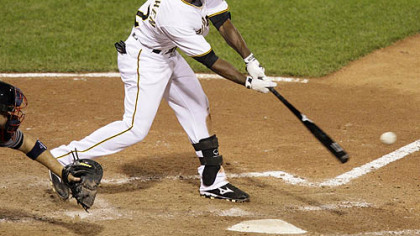 Pirates outfielder Andrew McCutchen, right, is congratulated by third base coach Tony Beasely, left, after hitting a two-run home run off Minnesota Twins pitcher Francisco Liriano in the third inning of last night's game in Minneapolis.