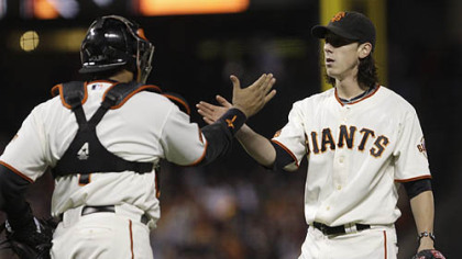 Giants pitcher Tim Lincecum, right, and catcher Bengie Molina celebrate the Giants' win.