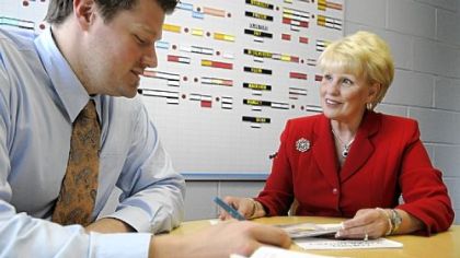 Donna Belas, new superintendent of the Cornell School District in Coraopolis, confers with high school principal Aaron Thomas.