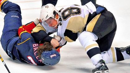 Panthers defenseman Keith Ballard ard Sidney Crosby fight in the first period Sunday in Sunrise, Fla.