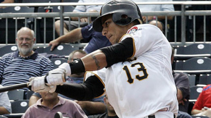Pirates shortstop Ronny Cedeno hits a three-run home run off Cubs pitcher Kevin Gregg during the eighth inning.