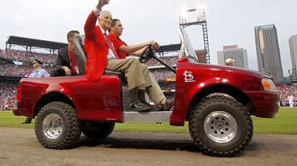 Former Cardinals' first baseman and Donora native Stan Musial waves as he arrives for the game.