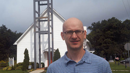 Bucknell sociologist Alexander T. Riley, outside the Flight 93 Memorial Chapel, is writing a book about the items left at the temporary memorial.