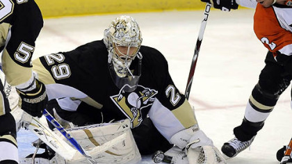 Marc-Andre Fleury makes a save on Flyers' Mike Knuble in overtime.