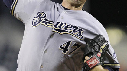 Brewers pitcher Mike Burns throws in the first inning.