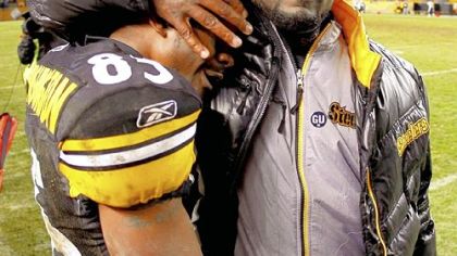 Mike Tomlin congratulates Nate Washington after a 11-10 victory against the Chargers Nov. 16 at Heinz Field.