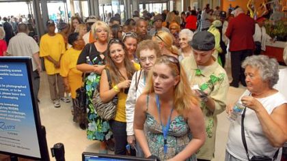 Guests line up to get a players card at the opening of the Rivers Casino on the North Shore.
