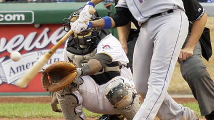 Mets first baseman Fernando Tatis hits a two-run home run in the sixth inning off Pirates pitcher Jeff Karstens yesterday.