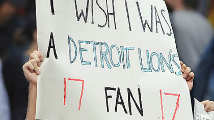 Ben Samson, left, and Iliya Udler, of Pittsburgh, hold up signs at the end of the Pirates' 4-2 loss to the Chicago Cubs.