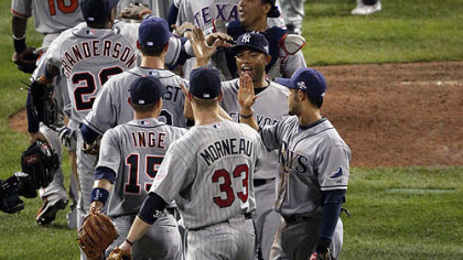 American League players congratulate each other after defeating the National League, 4-3.