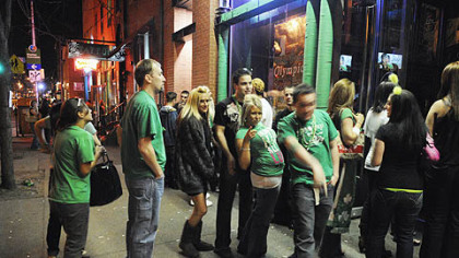 St. Patrick's Day revelers line up to get into Town Tavern on the South Side last week.
